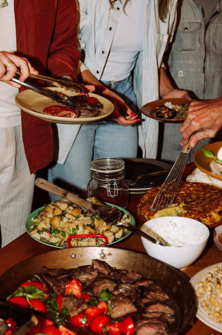 Plates and hands passing across a table.